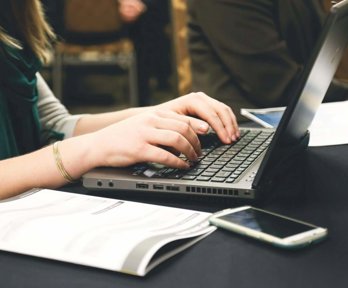 Person typing on a laptop