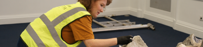 Charlotte Baron, one of the conservators, cleaning the surface of the model