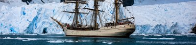 Ship at sea surrounded by ice