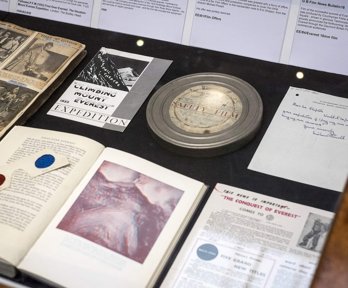 Display of historic materials including film reel, books, and advertisements