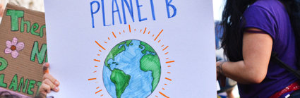 A group of students on a protest, holding a sign saying 'There is no planet B'