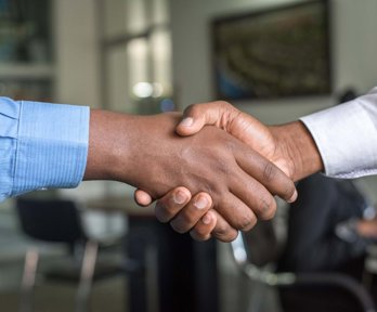 Close up of two people shaking hands