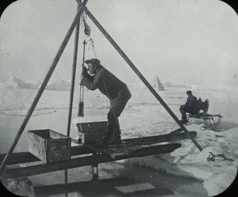 A man using scientific equipment in a polar environment